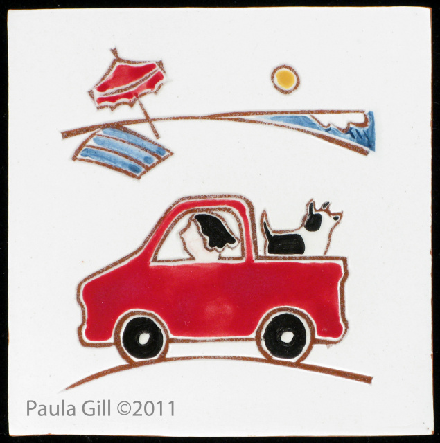 Girl in Red Truck with her dog at the Beach
