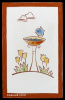 Blue Bird on Birdbath with Yellow Tulips